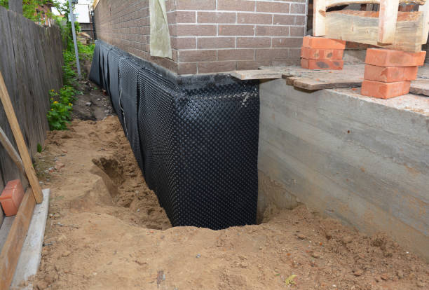 SJ Waterproofing Pros technician performing targeted Interior Drainage System assessment in Hayden, AL